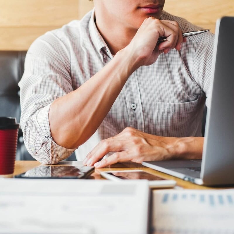 Small business owner reviewing digital marketing strategy and growth plan